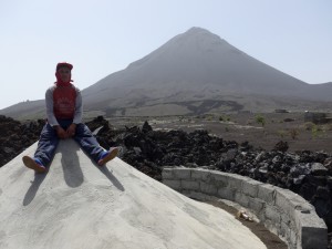 Zuka sitting on top of his house half buried in lava