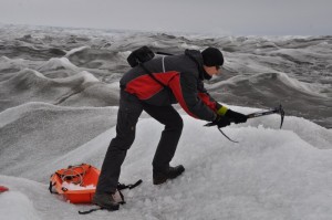 Daniel digging ice for water