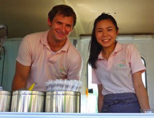 A couple selling peaches and refreshing peach drinks